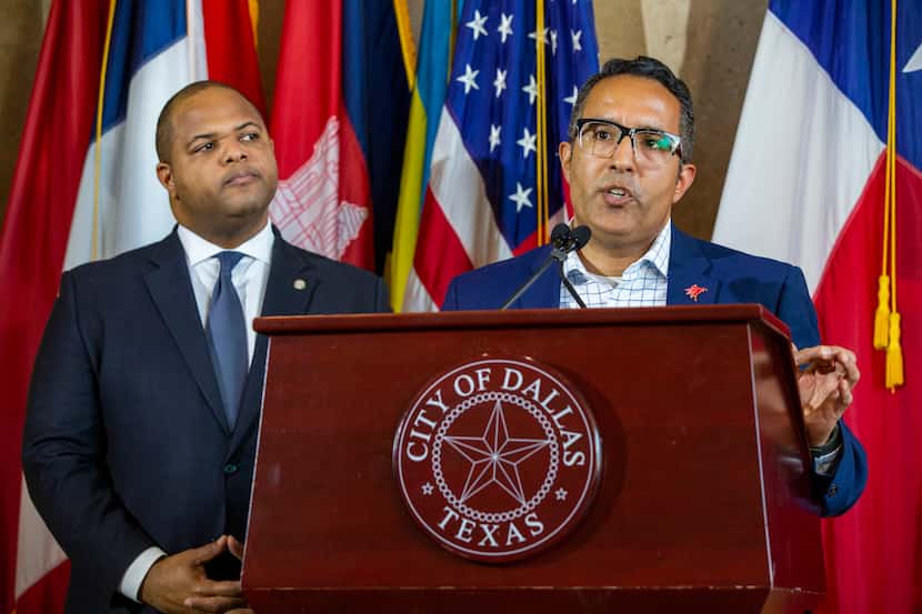 Assistant City Manager Joey Zapata (right) and Mayor Eric Johnson address the cancellation...