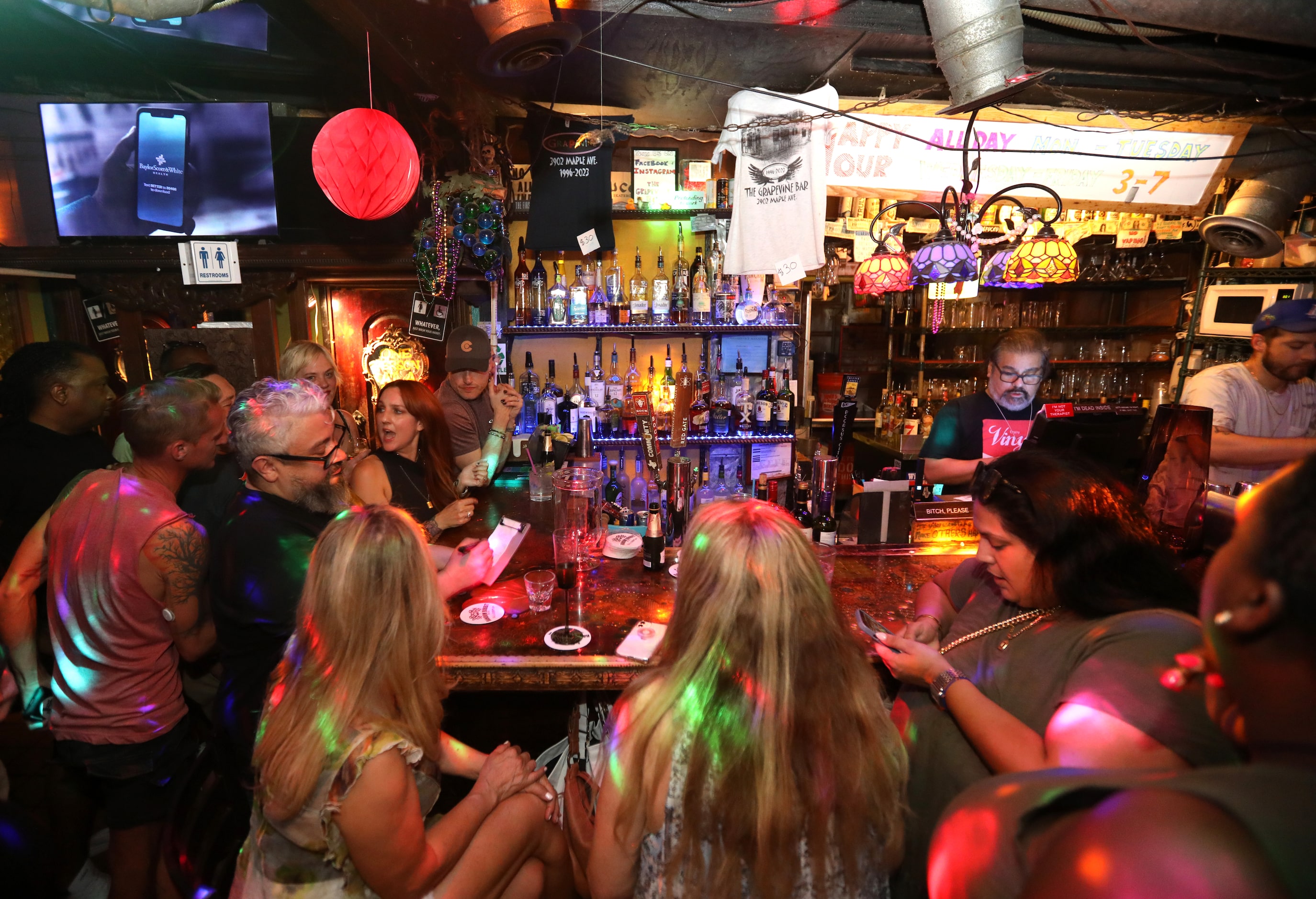 Guests enjoy one last evening at the Grapevine Bar in Dallas, TX, on Aug 23, 2023.  (Jason...