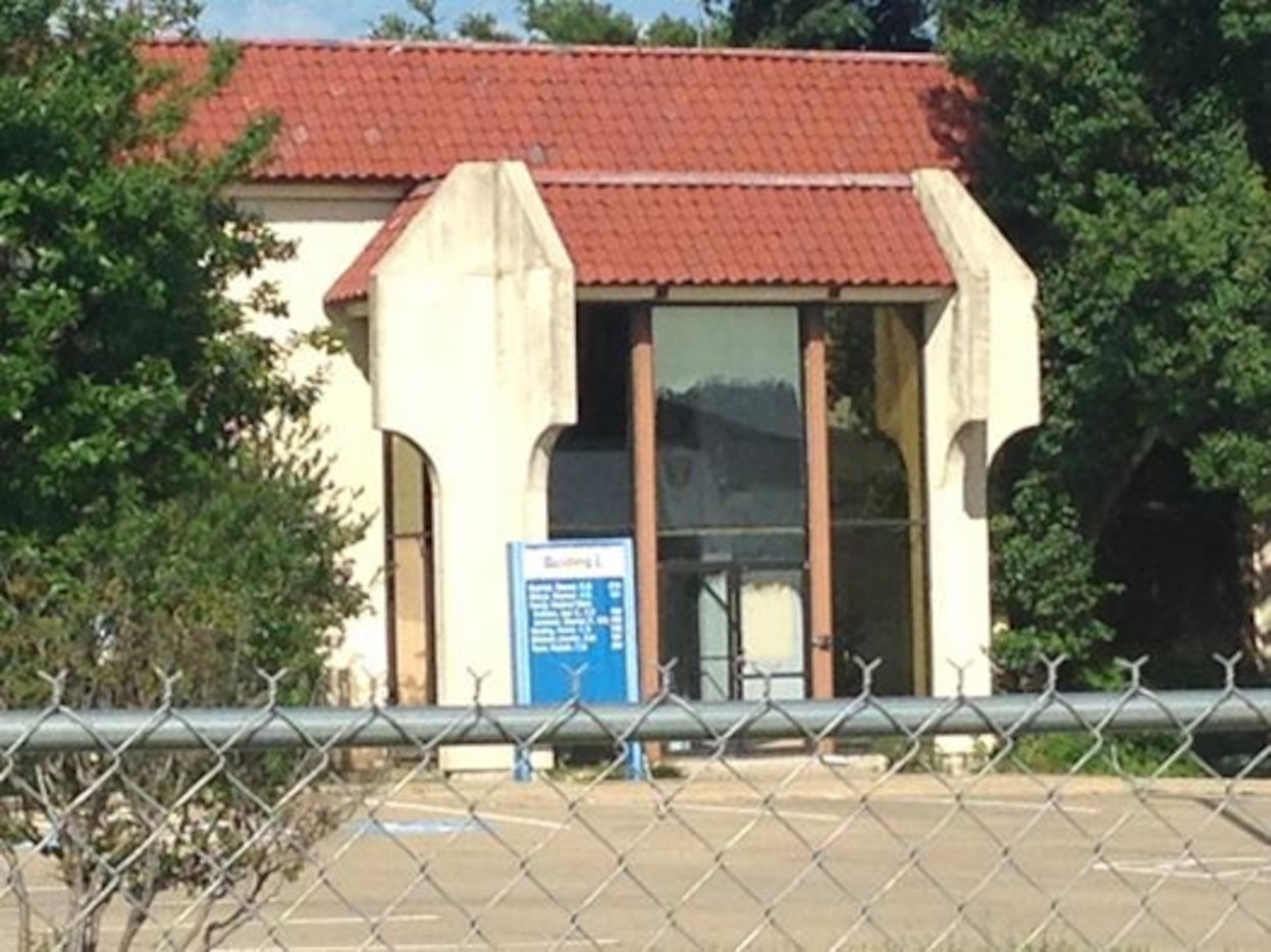 A mirrored glass office building is one of two razed in the last year at Motley Drive and...