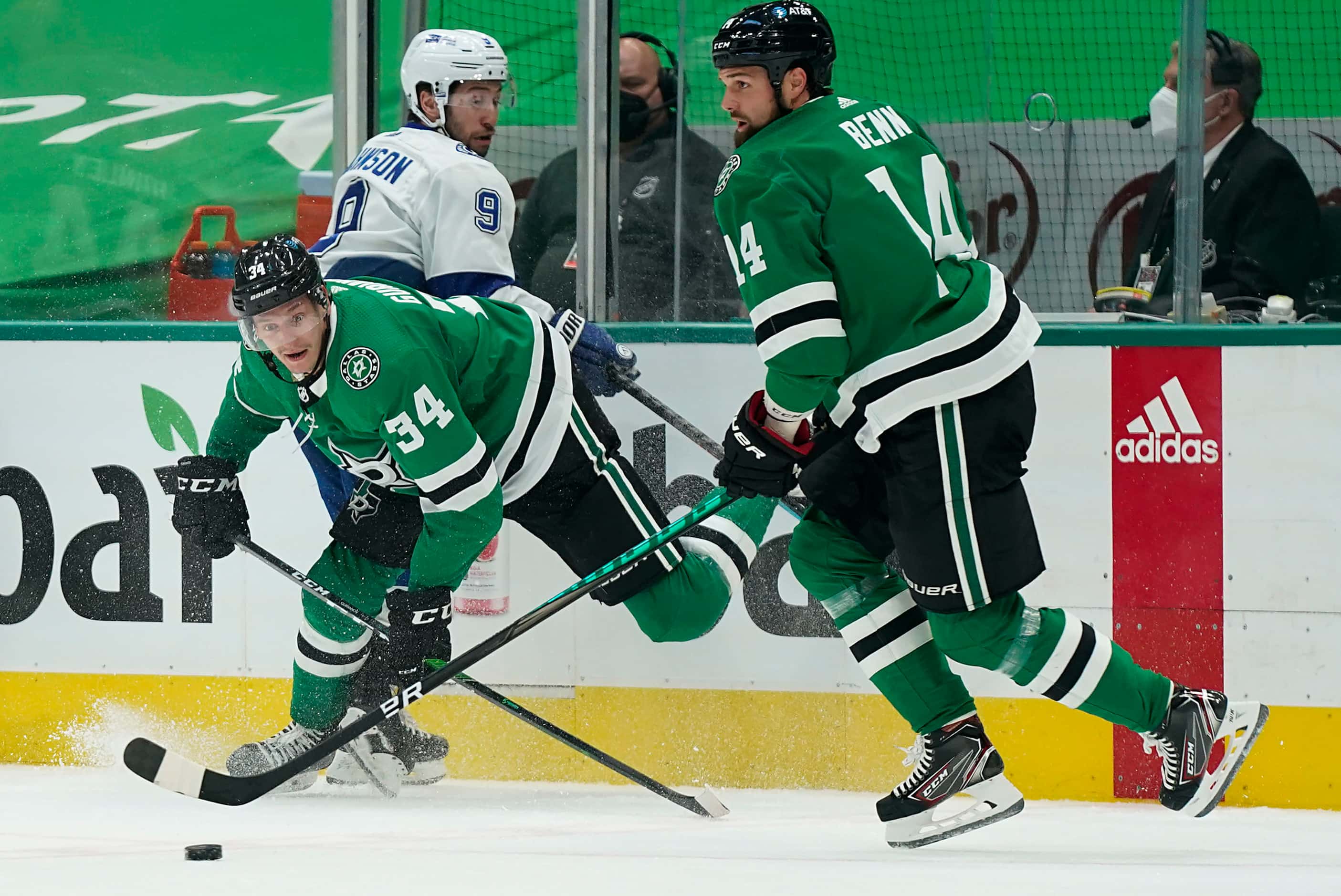 Dallas Stars right wing Denis Gurianov (34) clears the puck from along the boards to left...