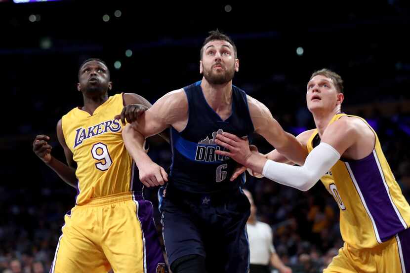 Andrew Bogut, shown here against the Lakers Tuesday night, will join Harrison Barnes in...