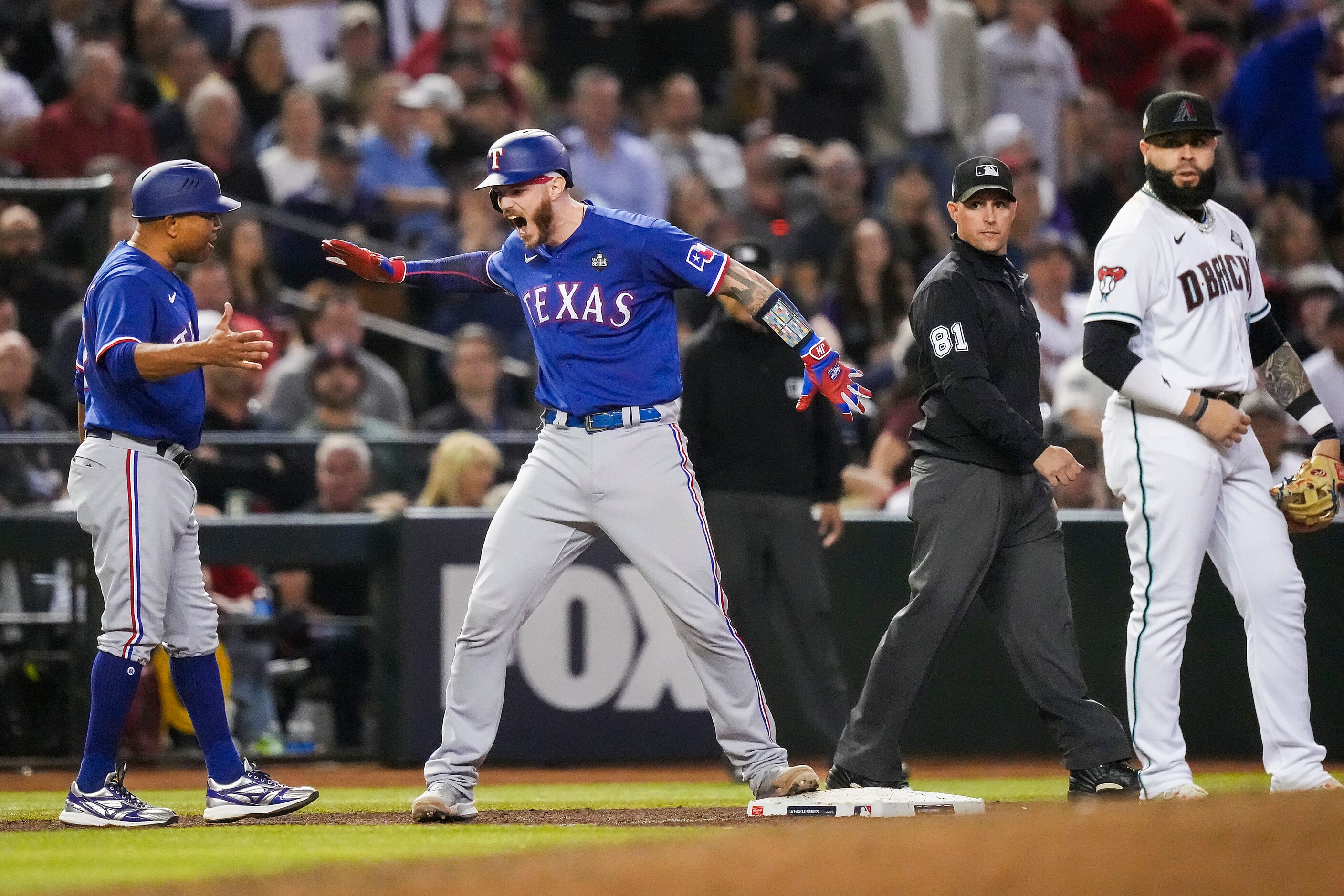 Texas Rangers’ Jonah Heim celebrates a after driving in Josh Jung and Nathaniel Lowe on a...