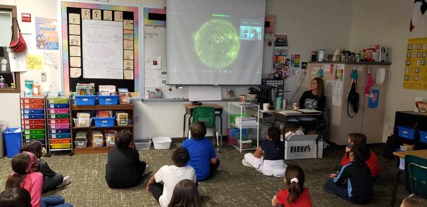 Sarah Fromhold, a digital learning coach at Shawnee Trail Elementary in Frisco ISD, shows a...