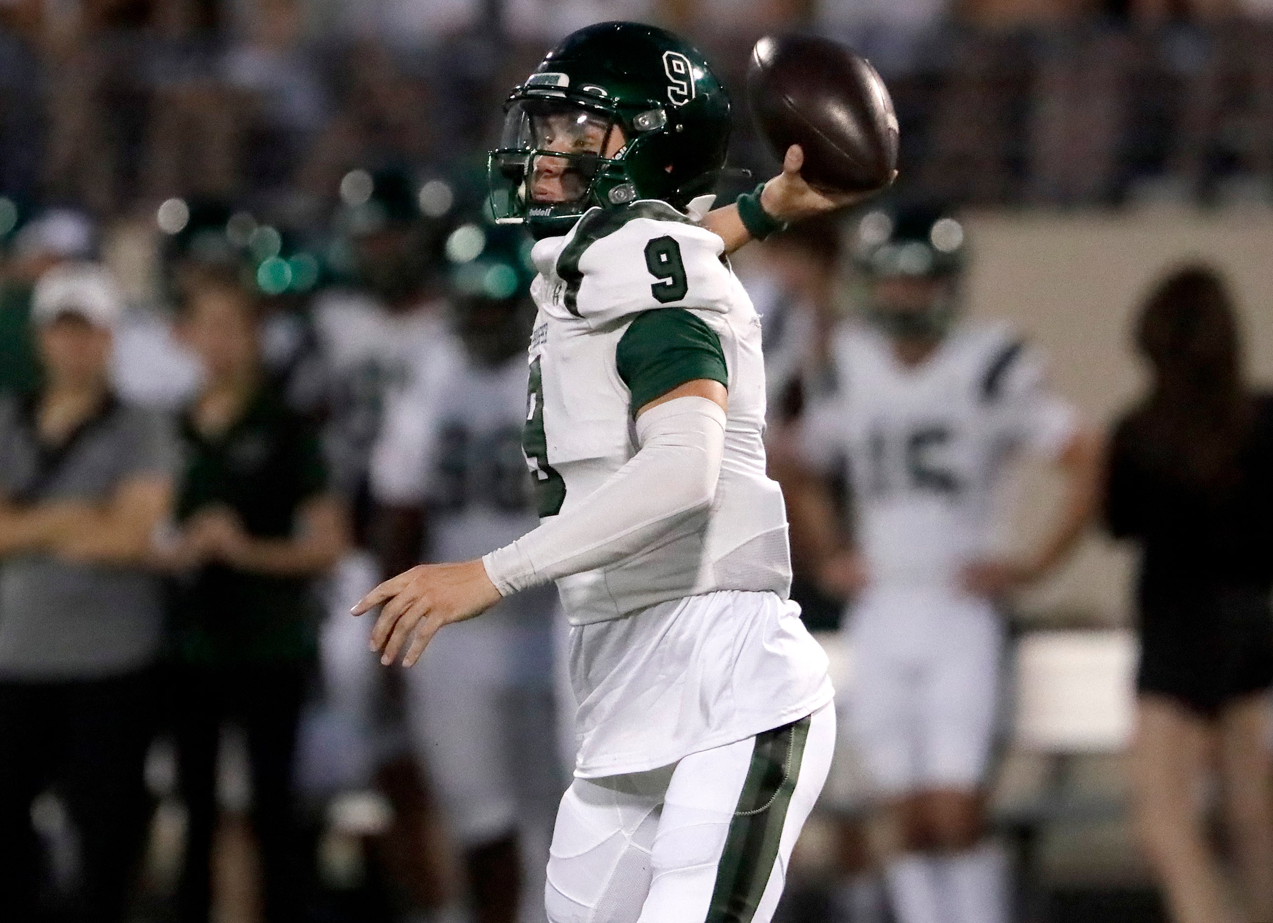 Prosper High School quarterback Braeden Imhoff (9) throws a pass during the first half as...