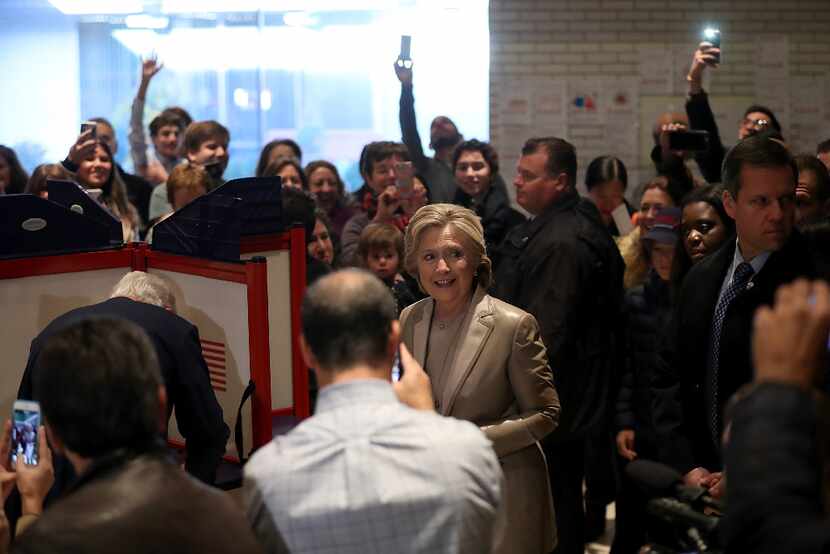 Democratic presidential nominee former Secretary of State Hillary Clinton is surrounded by...