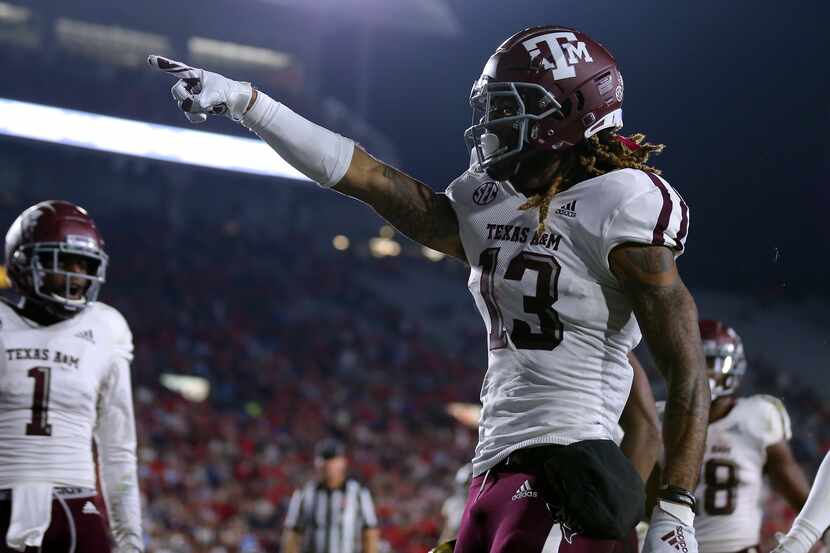 OXFORD, MISSISSIPPI - OCTOBER 19: Kendrick Rogers #13 of the Texas A&M Aggies celebrates a...