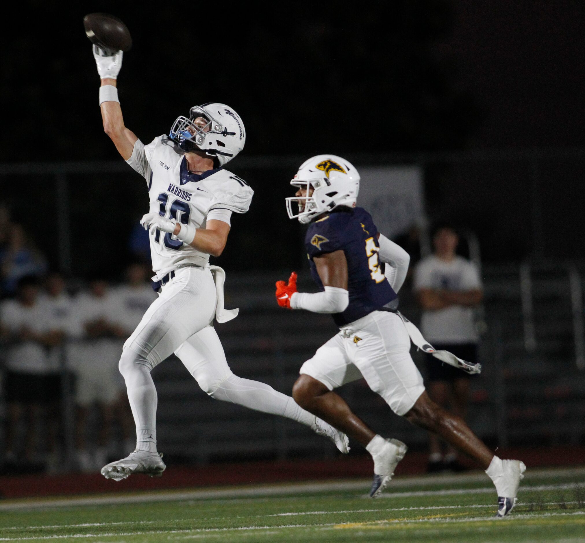 Argyle Liberty Christian receiver Brady Janusek (10), left, gets a pitch in the backfield...