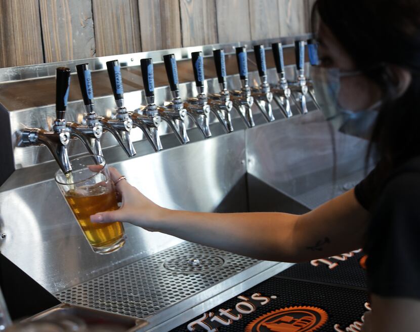Emily Fuselier pours a pint of Good Intentions beer at Cedar Creek Brewhouse and Eatery in...