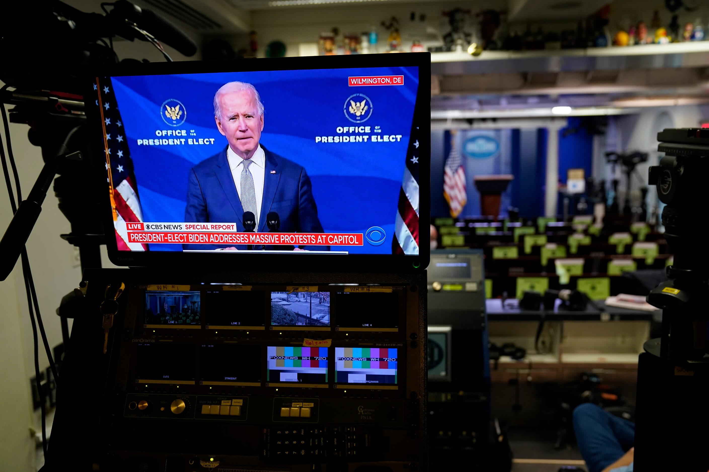 A screen in the briefing room of the White House in Washington displays a video of...