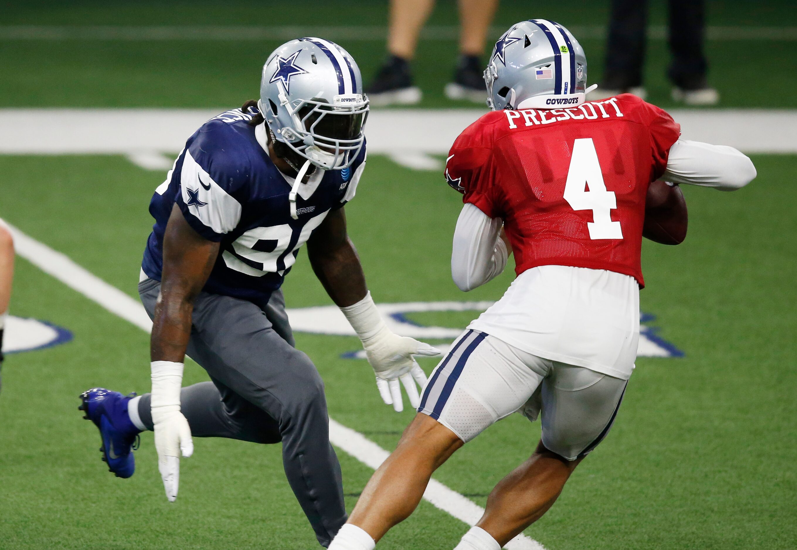 Dallas Cowboys defensive end DeMarcus Lawrence (90) pressures Dallas Cowboys quarterback Dak...