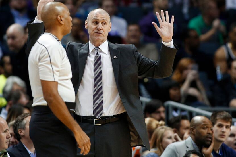 Dallas Mavericks coach Rick Carlisle, right, discusses a play with referee Karl Lane during...