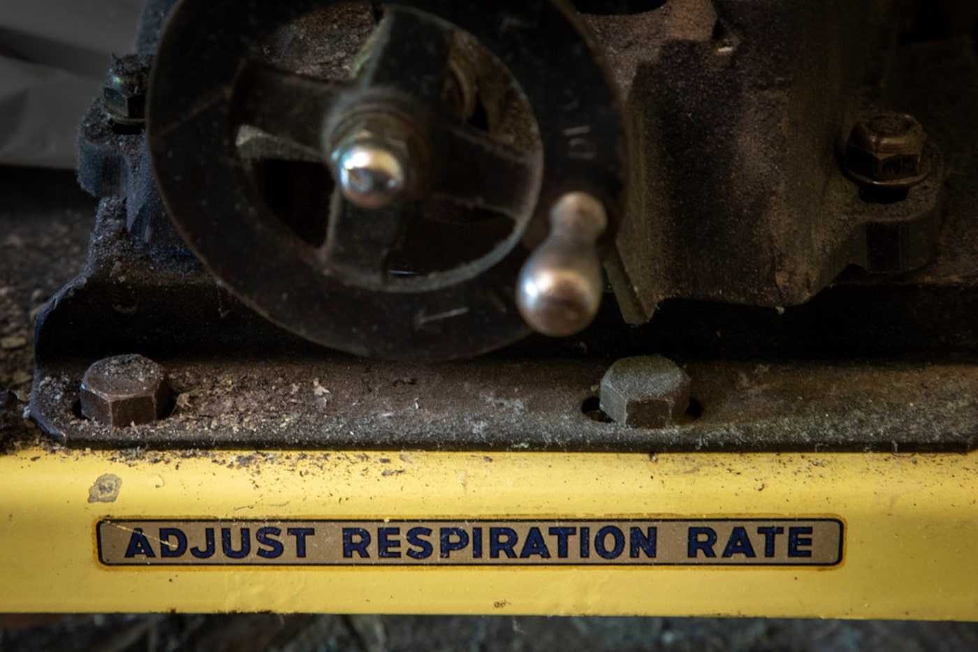 A mechanical wheel used to adjust the respiration rate on the iron lung of Paul Alexander at...