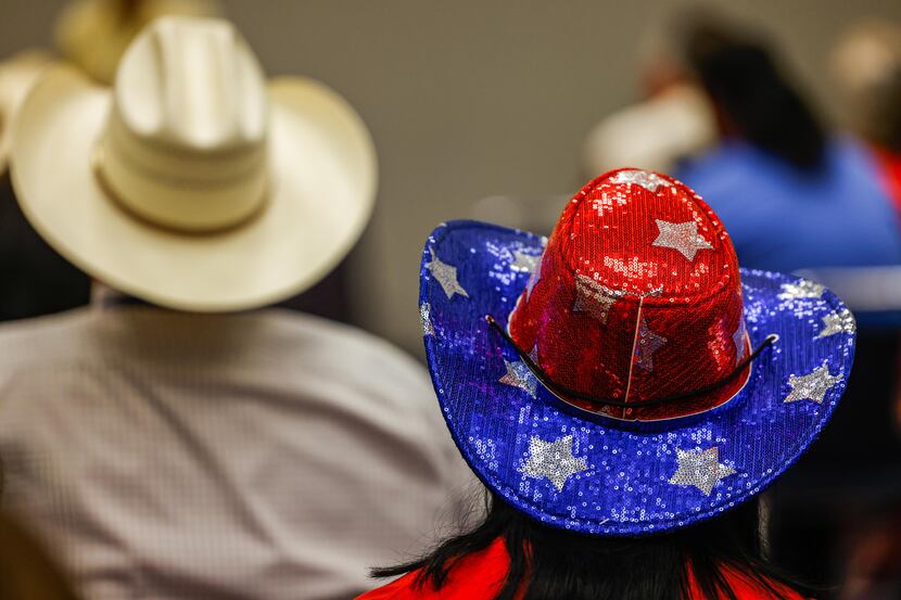 A person wears a cowboy hat decorated in blue, red and silver at the 2022 Republican Party...
