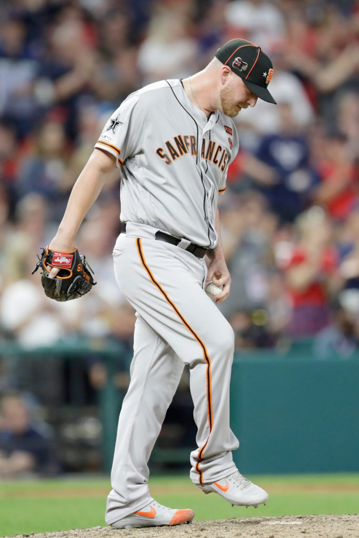 National League pitcher Will Smith, of the San Francisco Giants, reacts after giving up a...