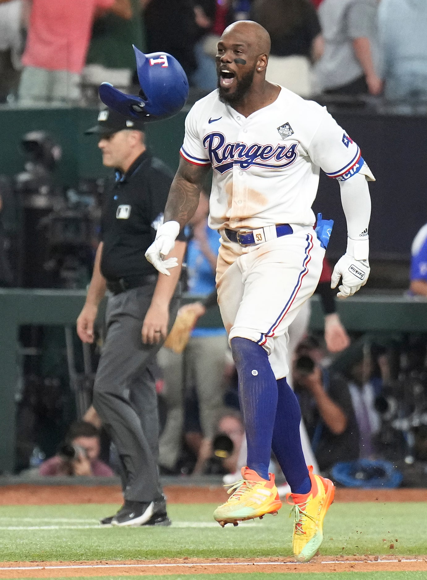 Texas Rangers' Adolis Garcia celebrates after hitting a walk-off home run during the...