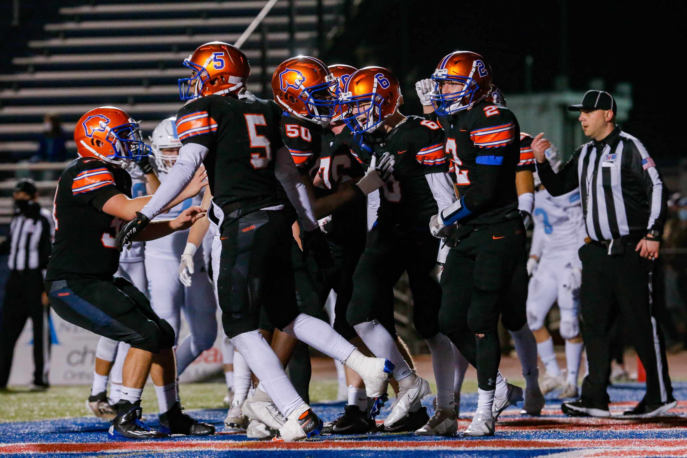 Colleyville Covenant players celebrate Caleb Turner's (6) touchdown before halftime during a...