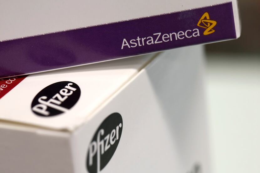 A box of EMLA cream, produced by AstraZeneca Plc, top, sits on a box of Arthrotec 50...