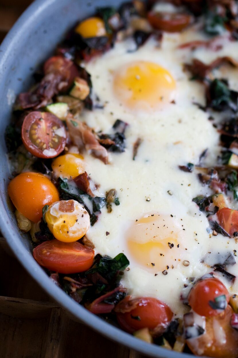 In this image taken on April 15, 20133, skillet garden eggs with fontina are shown in...