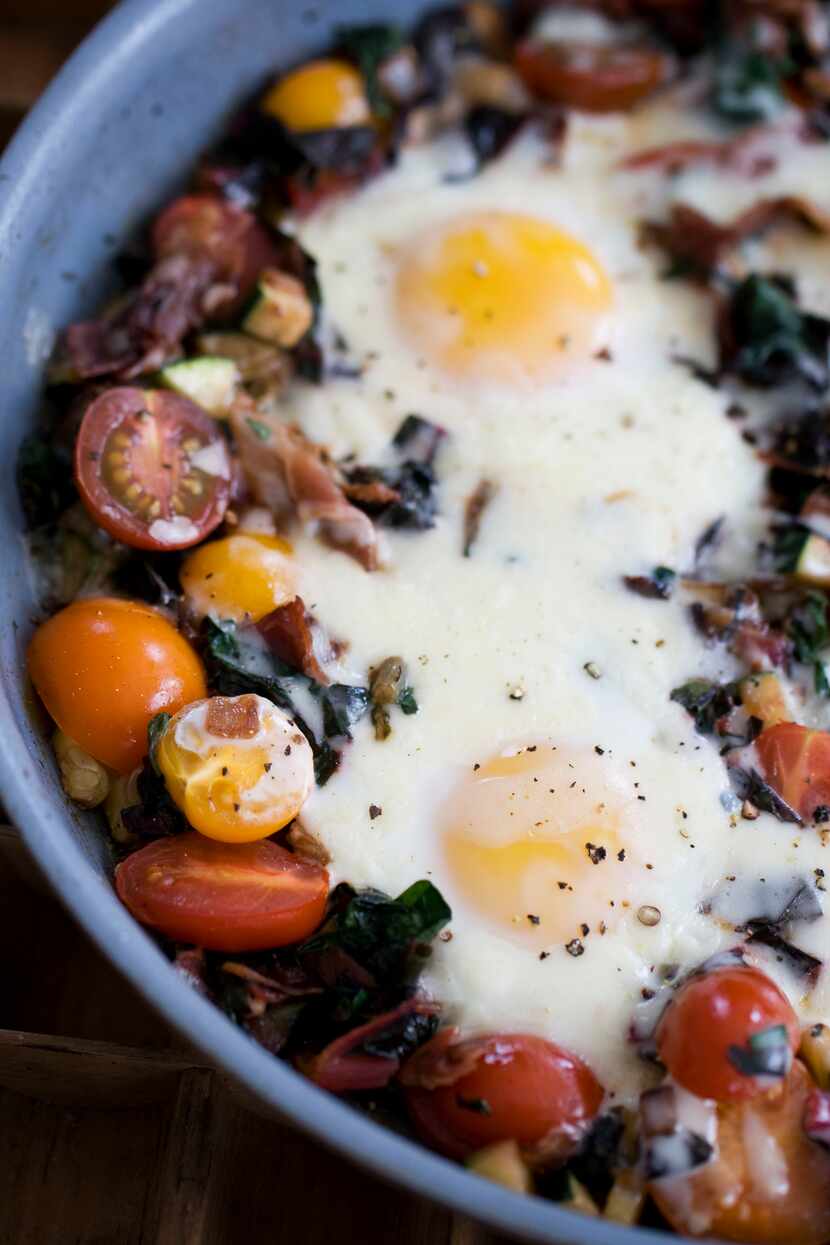 In this image taken on April 15, 20133, skillet garden eggs with fontina are shown in...