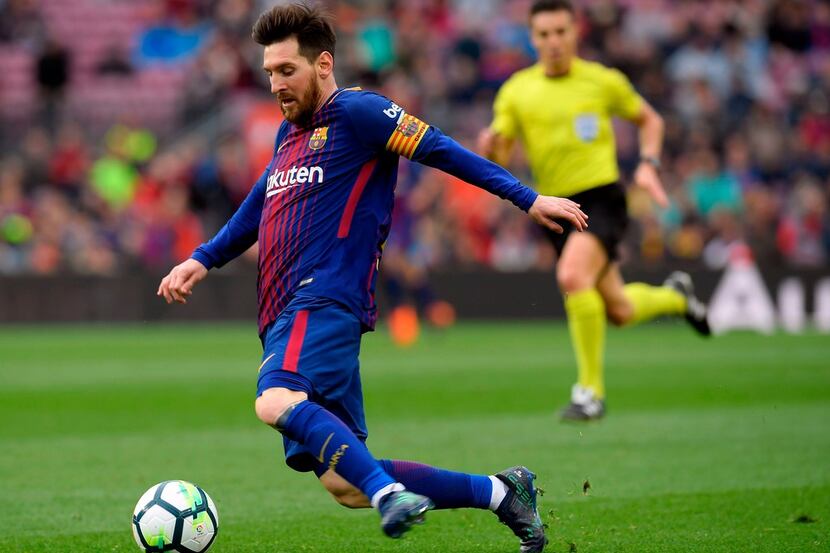 Barcelona's Argentinian forward Lionel Messi kicks the ball during the Spanish league...