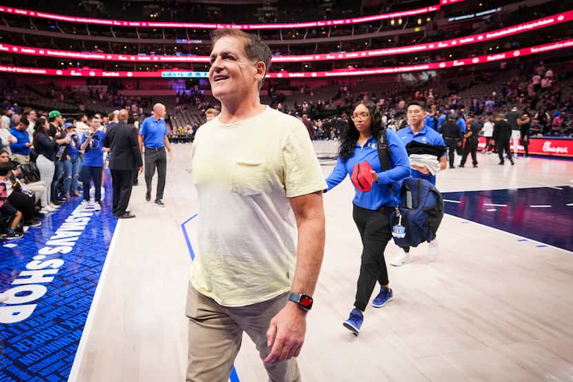 Dallas Mavericks owner Mark Cuban leaves the court after an NBA preseason basketball game...