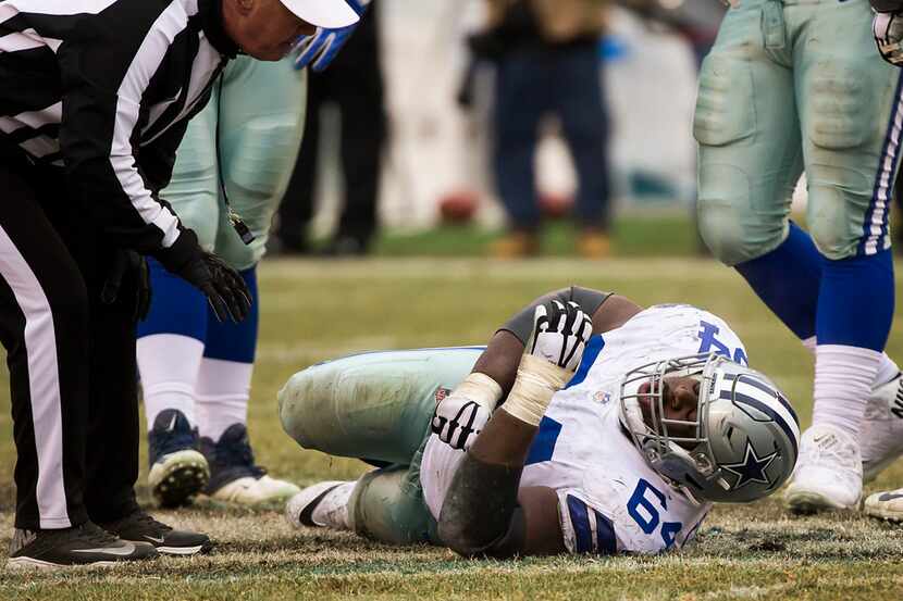 Dallas Cowboys offensive guard Jonathan Cooper receives attention after being injured during...
