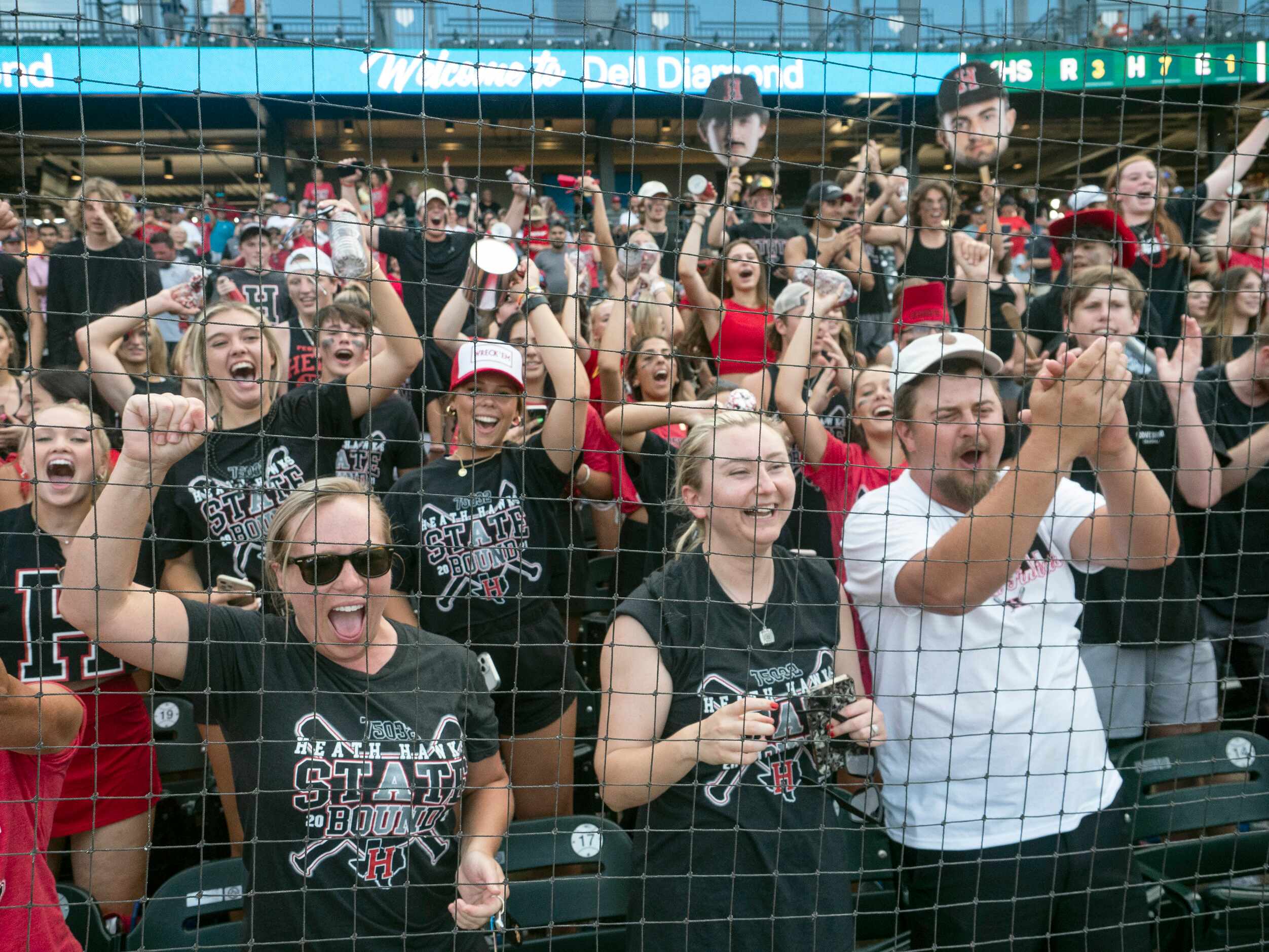 Rockwall-Heath fans celebrate the Hawks victory over the Keller Indians during the # inning...
