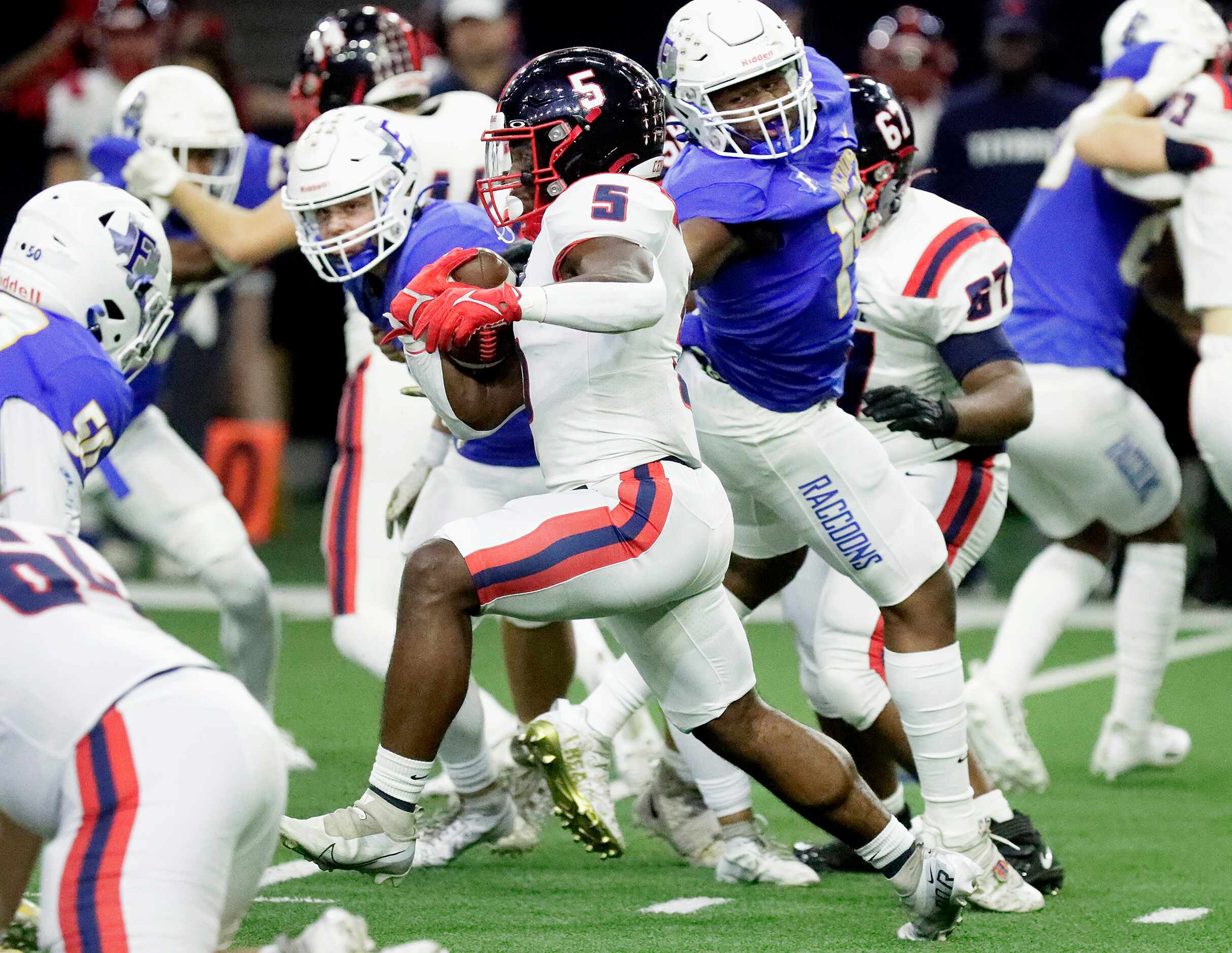 Centennial High School running back Harry Stewart (5) carries the football during the first...