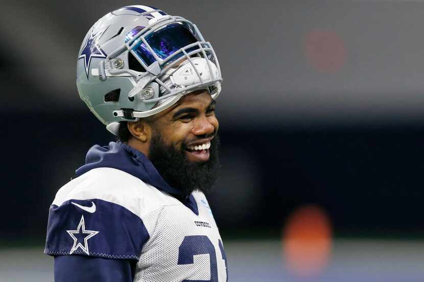 Dallas Cowboys running back Ezekiel Elliott (21) laughs during practice in the Ford Center...
