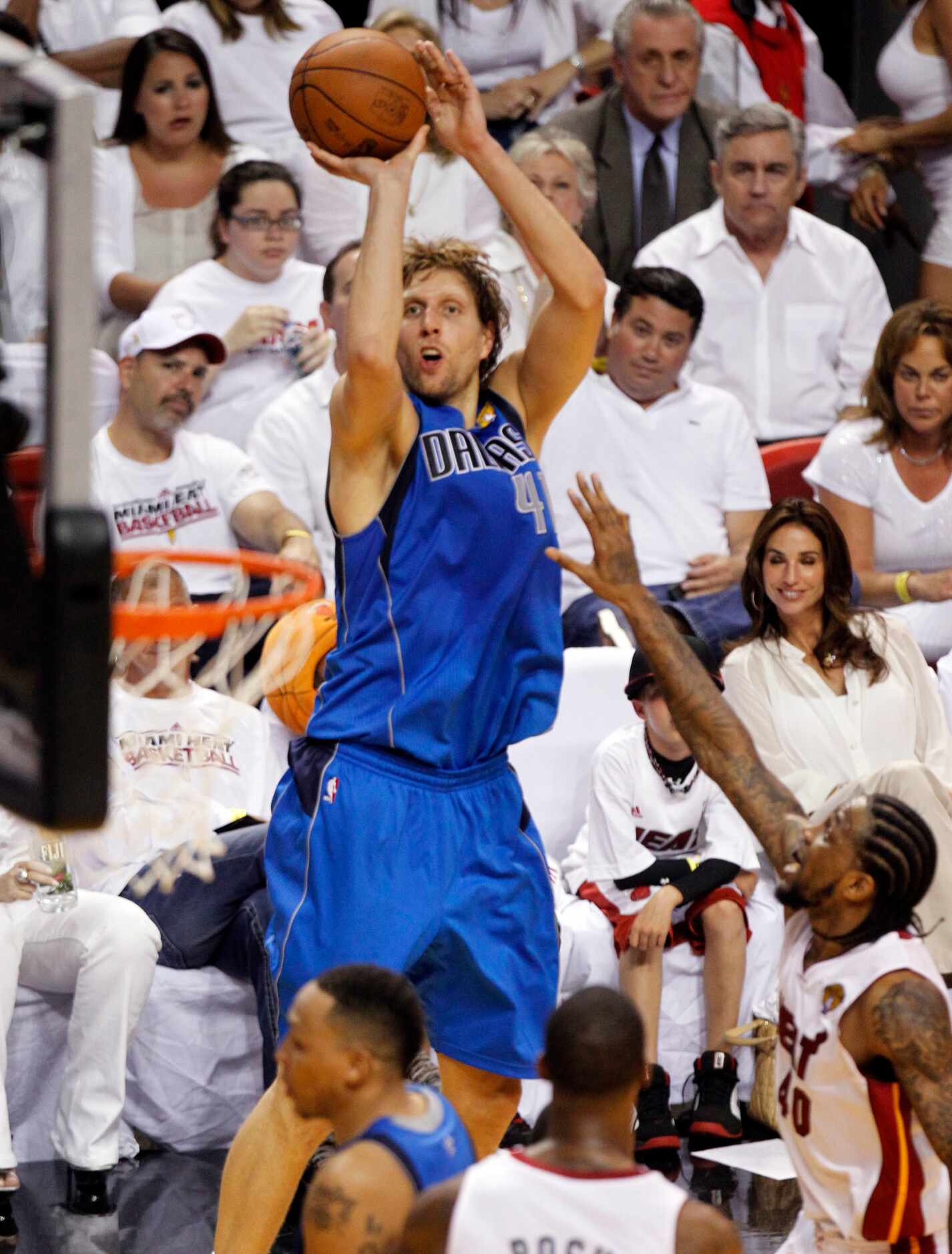 Dallas Mavericks power forward Dirk Nowitzki (41) shoots as he is defended by Miami Heat...