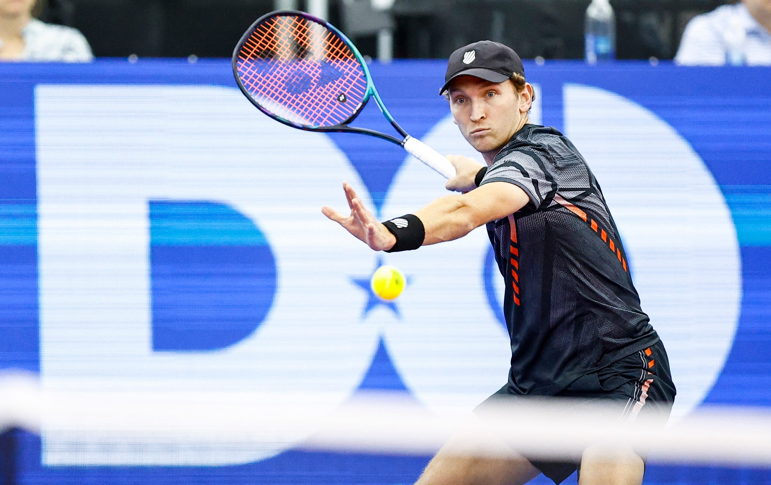 Mitchell Krueger, a Fort Worth native, returns the ball in a match against Yoshihito...