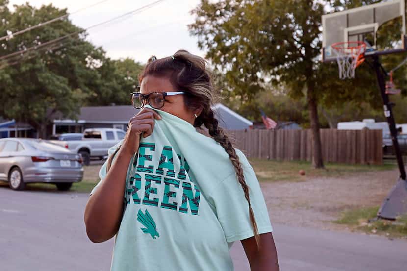 Rosa Donohoe covered her nose while walking near her house on Oct. 3 in Dallas. Several...