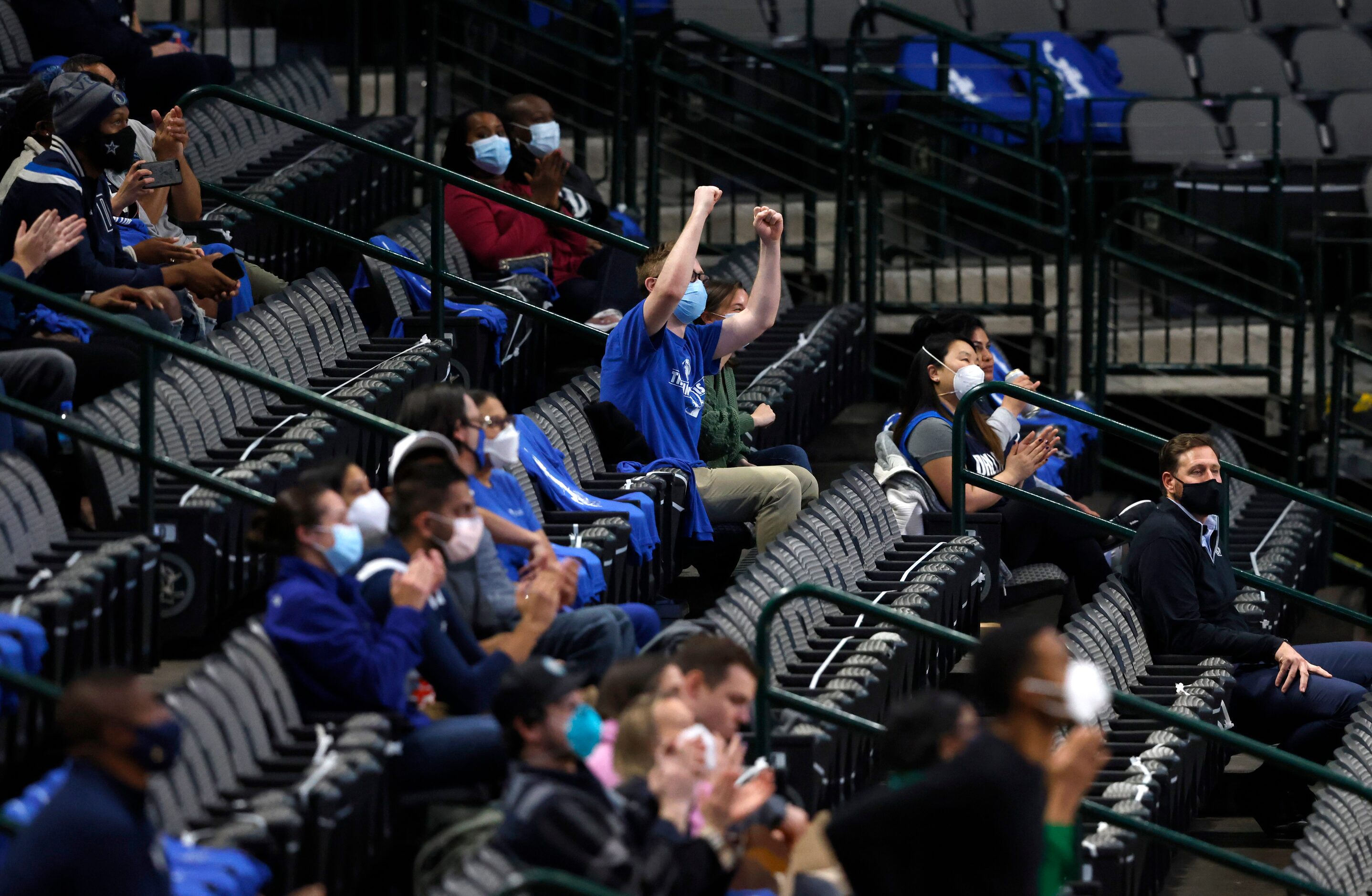 First responders cheer as they are recognized during the second quarter of play between the...