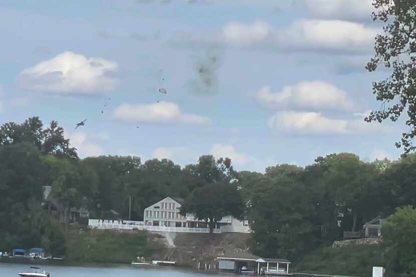 This image provided by Michelle Quezada a jet crashing during an air show on Sunday, Aug....