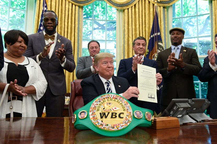 President Donald Trump center, posthumous pardons Jack Johnson, boxing's first black...