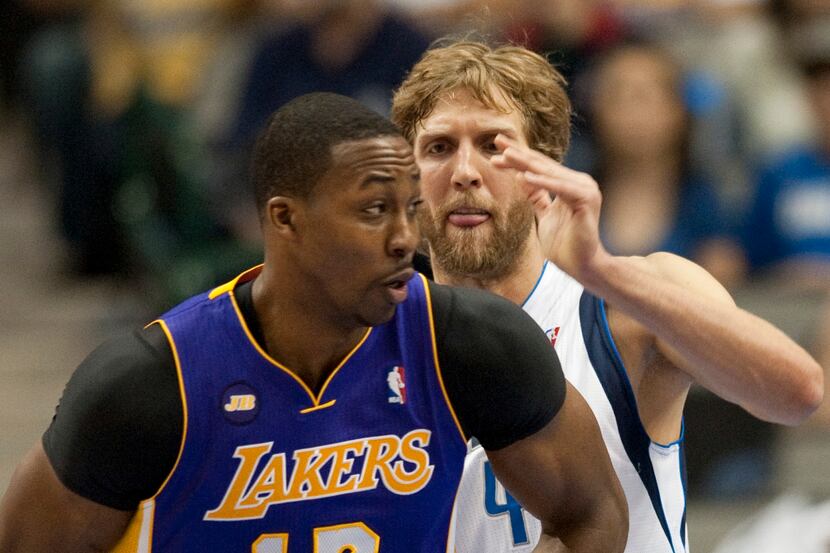 Dirk Nowitzki (41) of the Dallas Mavericks defends against Dwight Howard (12) of the Los...