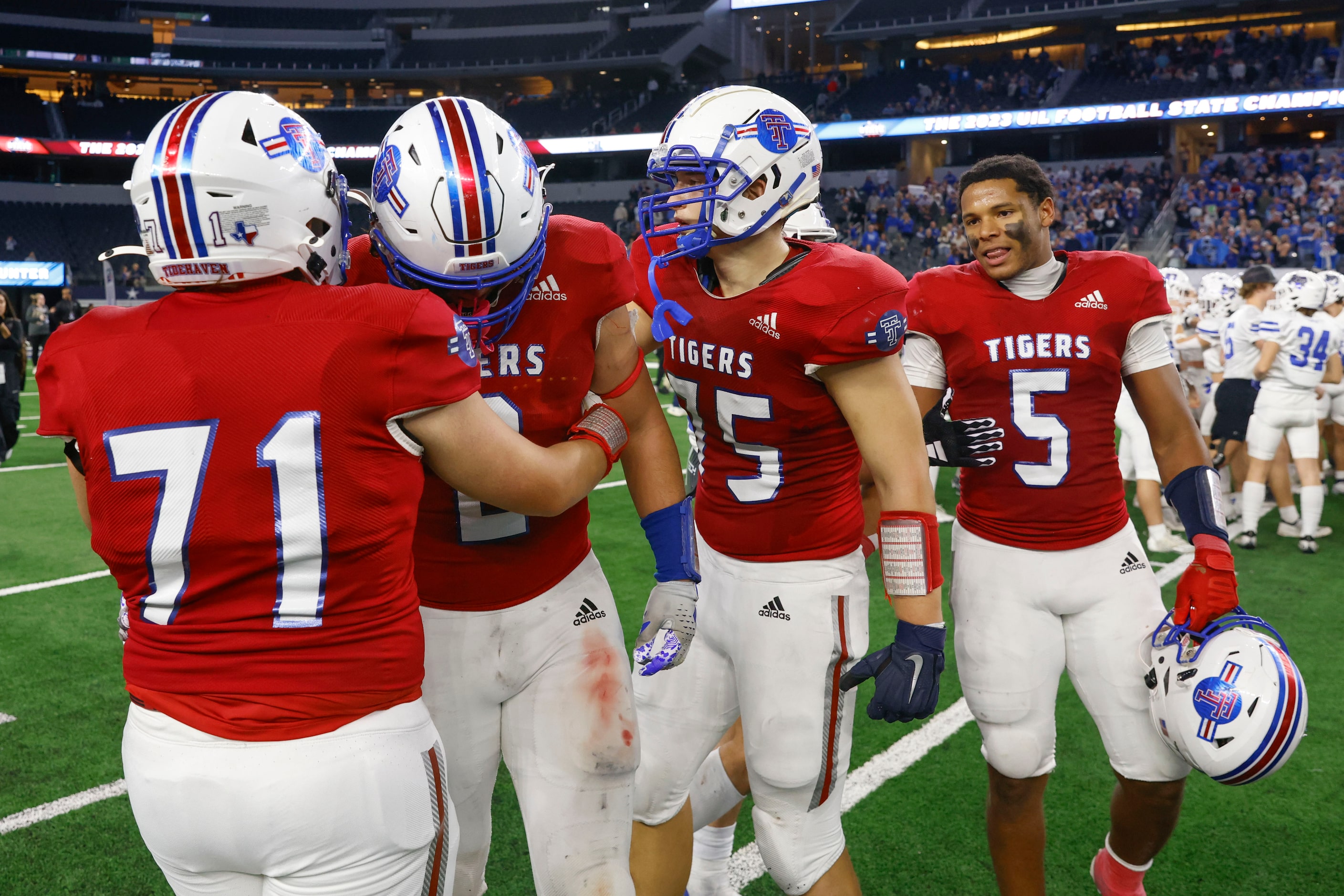 El Maton Tidehaven players comfort each other after Gunter High wins Class 3A Division II...