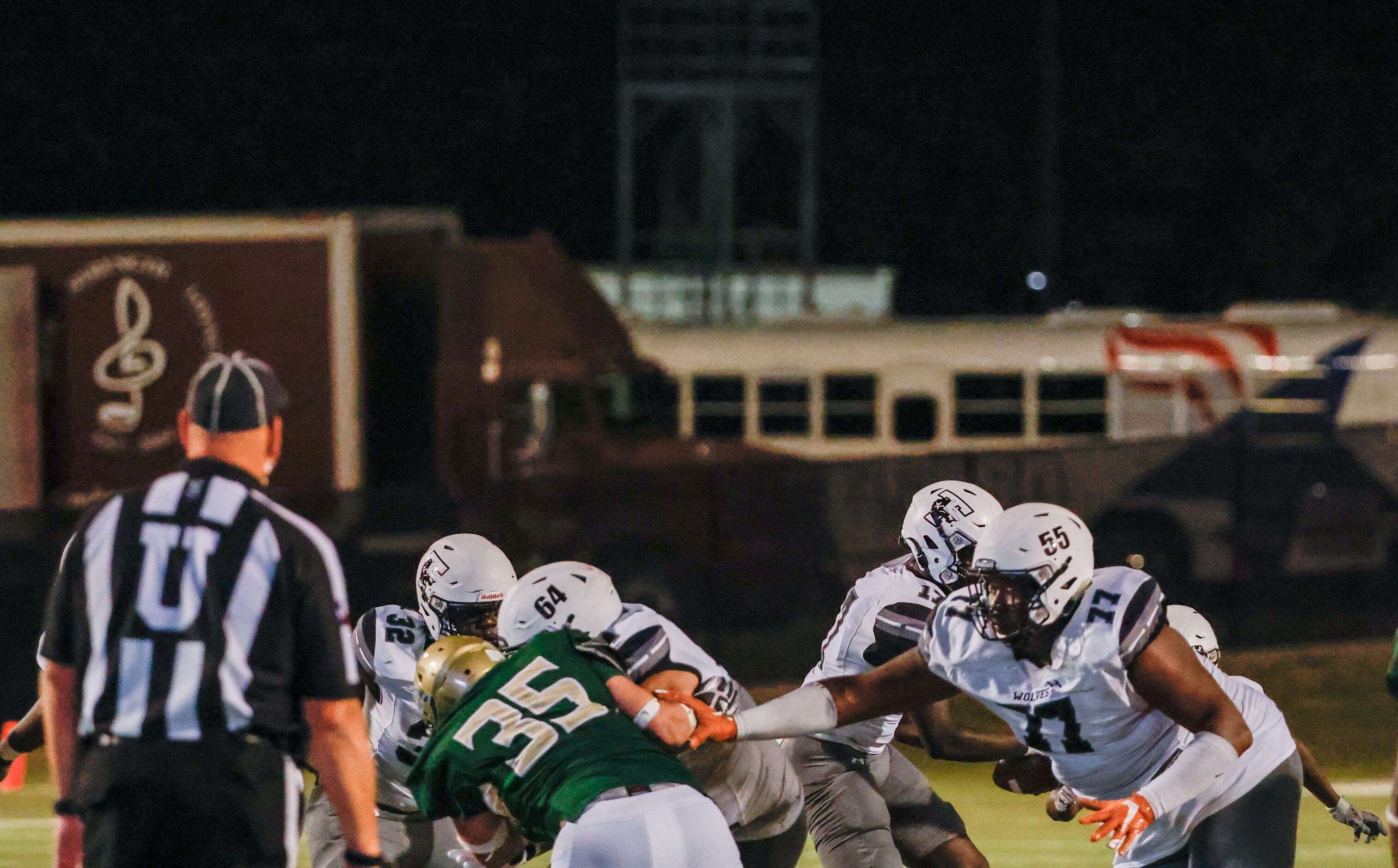 Mansfield Timberview offensive line Andre Cojoe (77) reaches for Birdville defensive lineman...