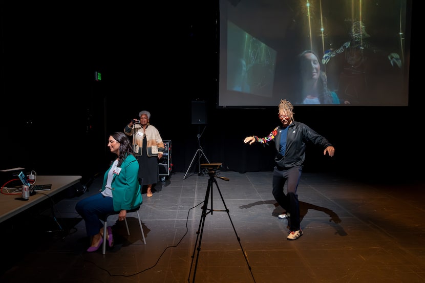 Maura Sheffler, Vicki Meek and workshop instructor Thomas F. DeFrantz participate in an...