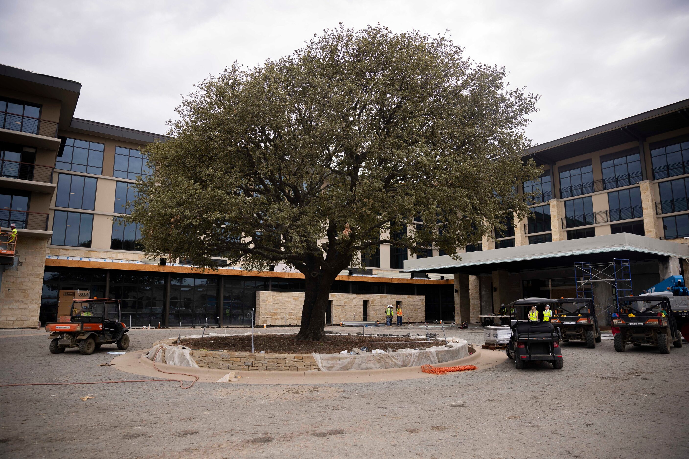 Construction workers prepare the entrance of the Omni PGA Frisco resort.