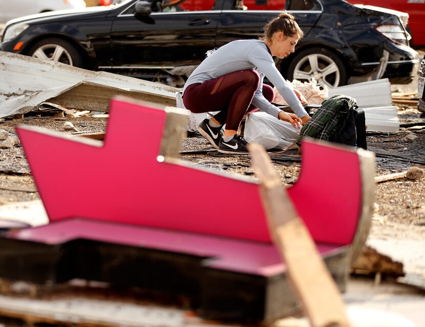 Rachel Ellis-Piantanida, who was cleaning out her destroyed car in the Marsh Lane Plaza...