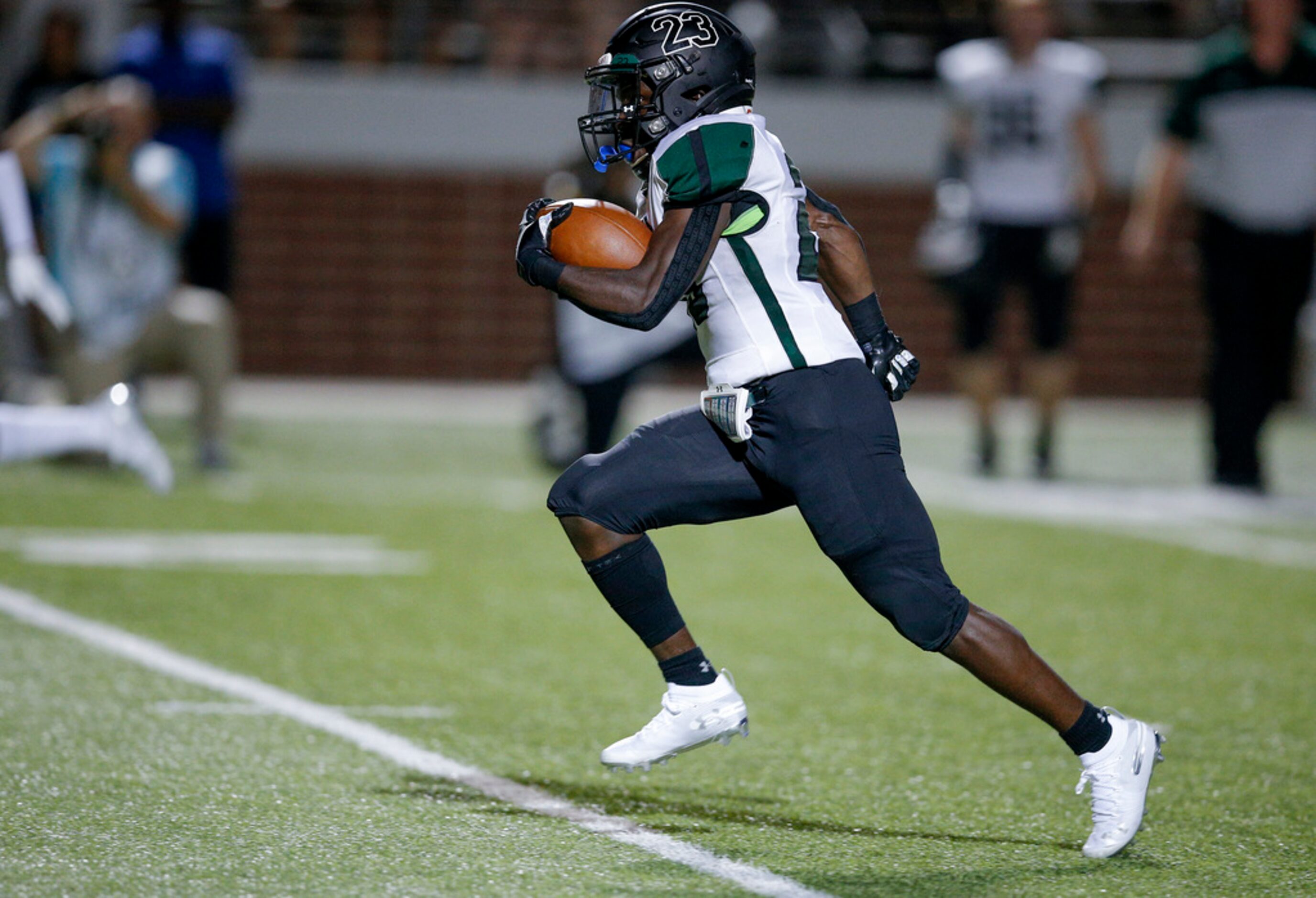 TXHSFB Mansfield Lake Ridge senior wide receiver Tameron Derrough (23) looks for room...