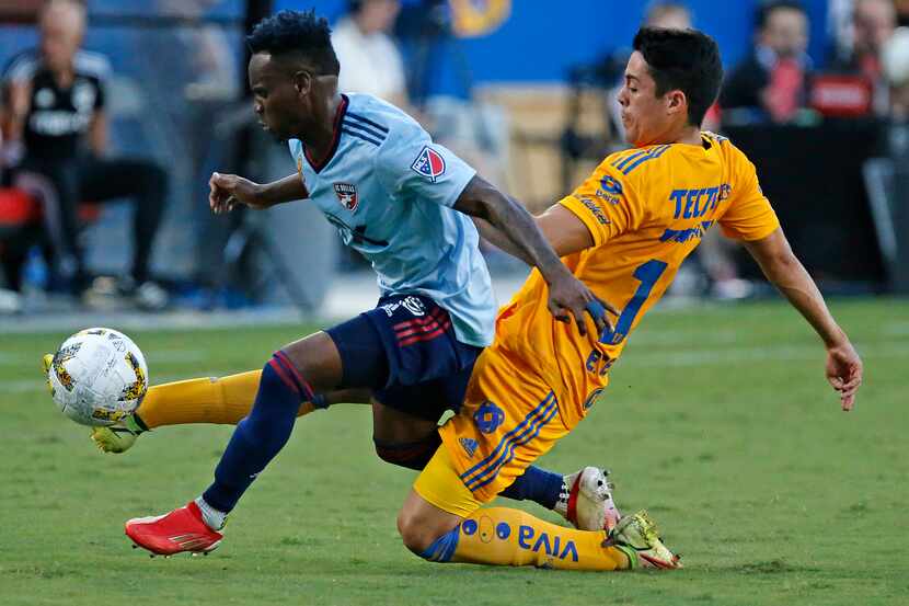 Tigres UNAL defender Eduardo Tercero (15) goes through FC Dallas midfielder Jader Obrian...