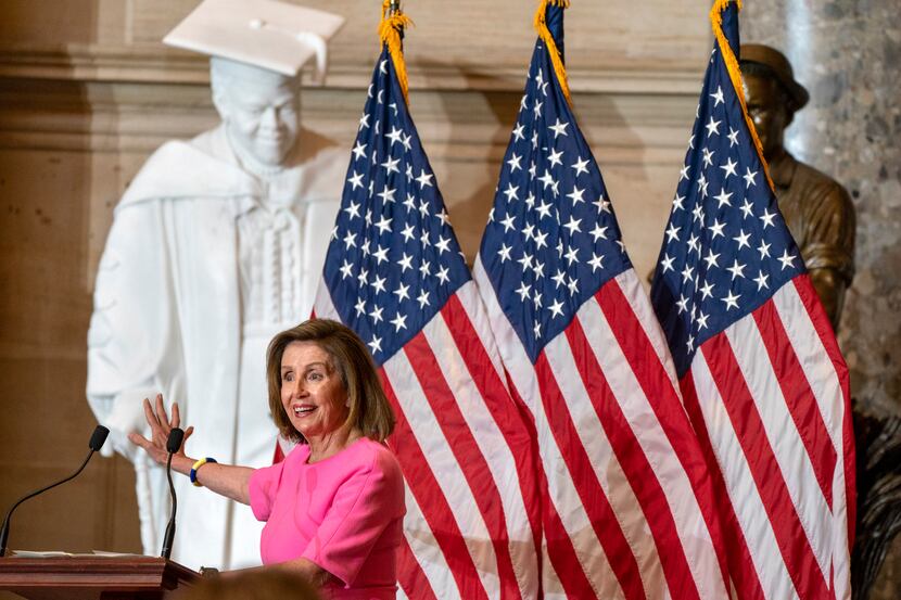 Speaker of the House Nancy Pelosi of Calif., speaks in front of a statue of civil rights...