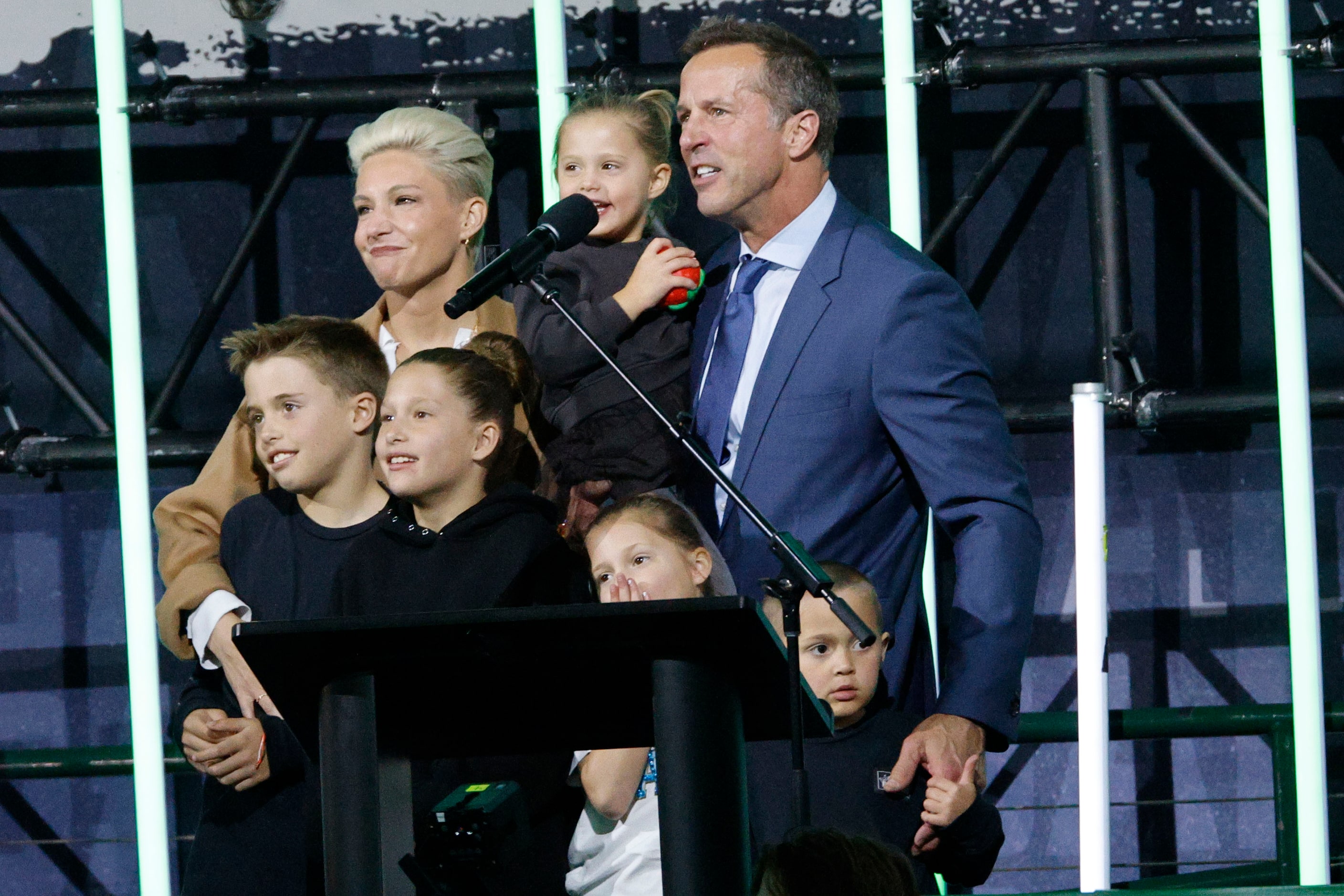 Dallas Stars legend Mike Modano and his family watch video during the unveiling ceremony of...