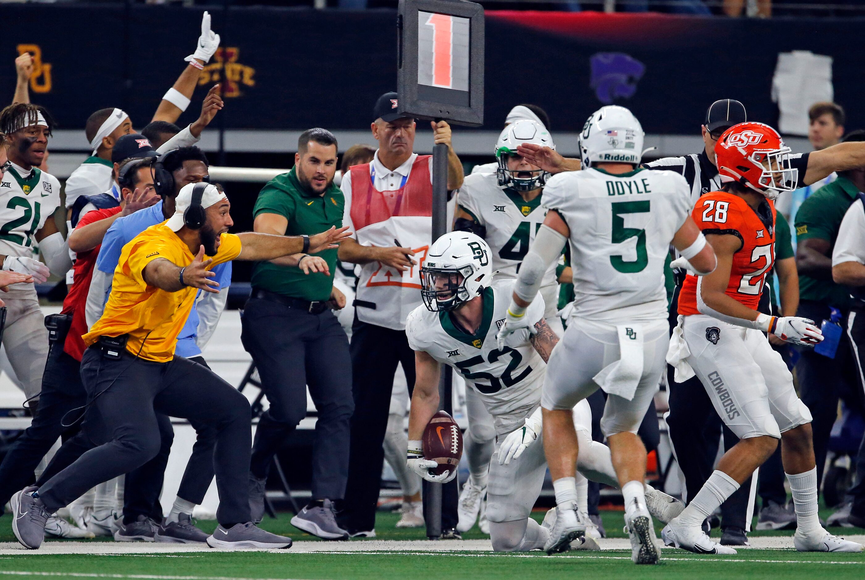 The Baylor bench celebrates, after an interception by linebacker Matt Jones (52) during...