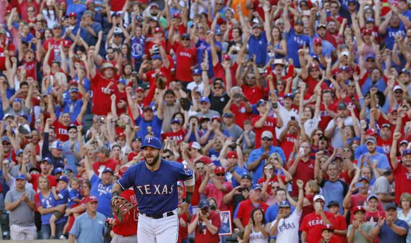 Texas Rangers first baseman Mitch Moreland (18) heads to celebrate with teammates as Rangers...