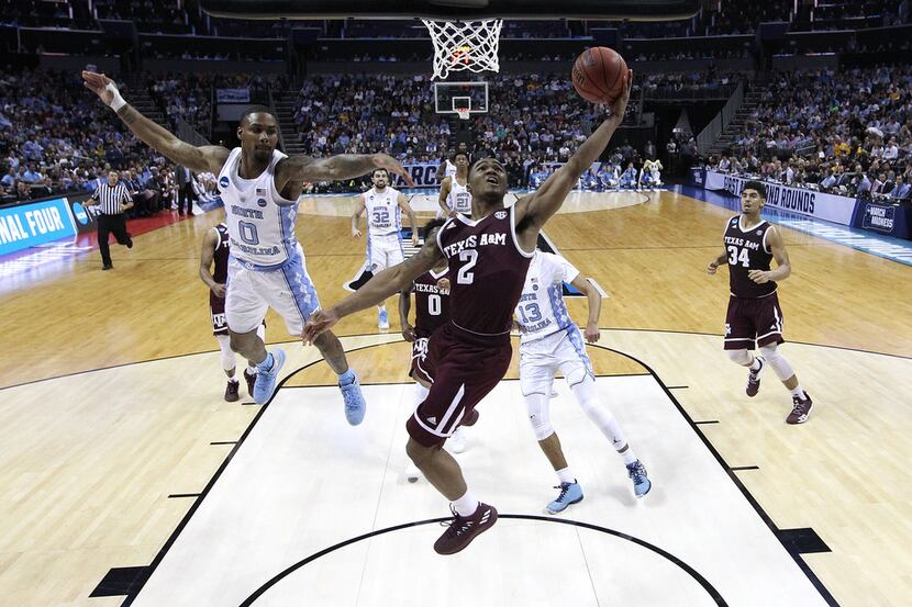 CHARLOTTE, NC - MARCH 18:  TJ Starks #2 of the Texas A&M Aggies lays up a shot against...
