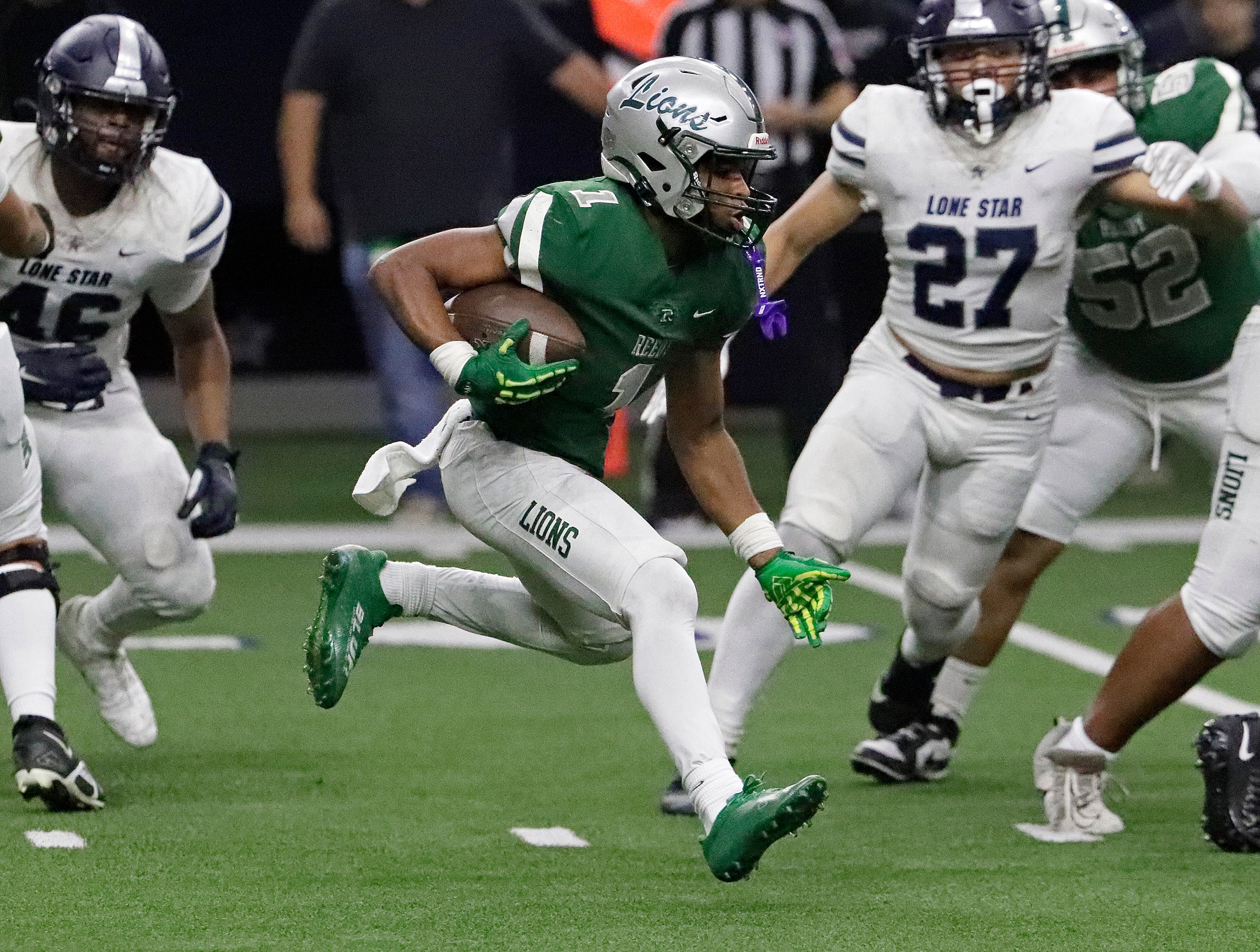 Reedy High School running back Triston Airy (1) carries the ball during the second half as...