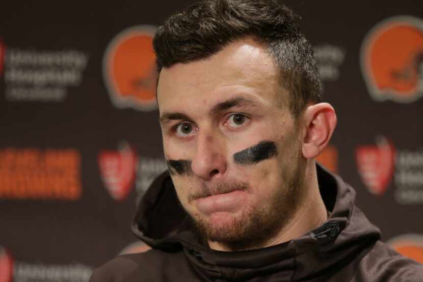 Cleveland Browns quarterback Johnny Manziel speaks with media members following the team's...